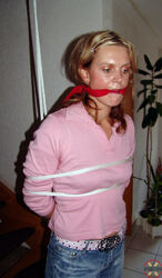 ladies ball-gagged and corded. Photo #3